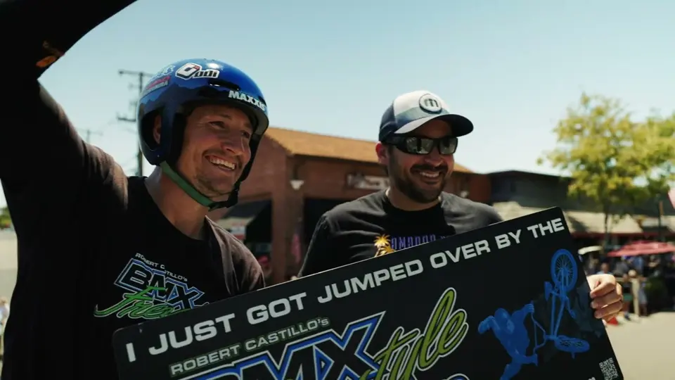 BMX riders celebrating at a downtown festival
