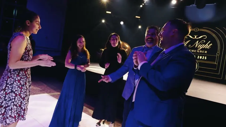 Guests on stage at a school gala